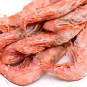Crevettes et gambas entières crues surgelées